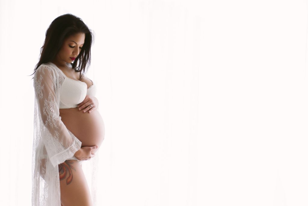Using a lacy robe for your maternity boudoir shoot